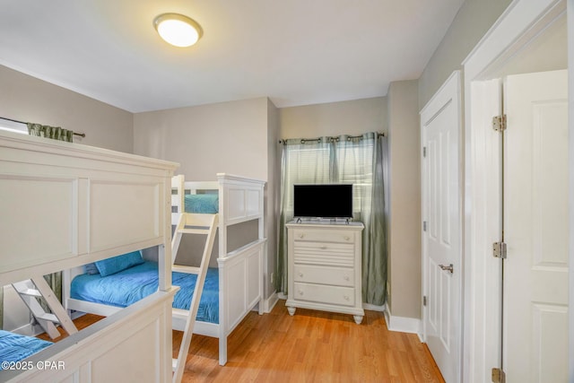 bedroom with light wood-style floors