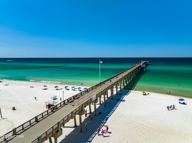 drone / aerial view with a beach view and a water view