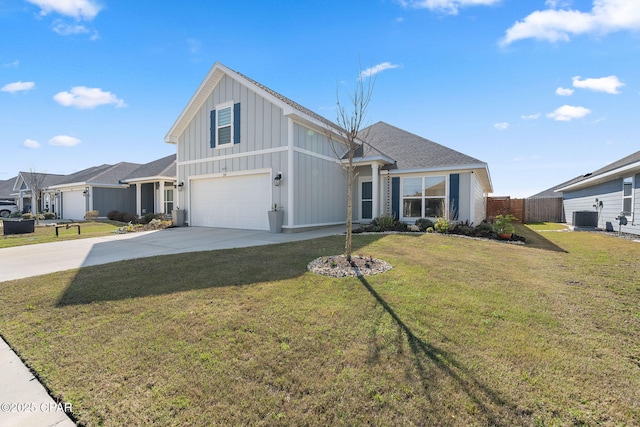 view of front of home with an attached garage, board and batten siding, fence, central AC unit, and driveway