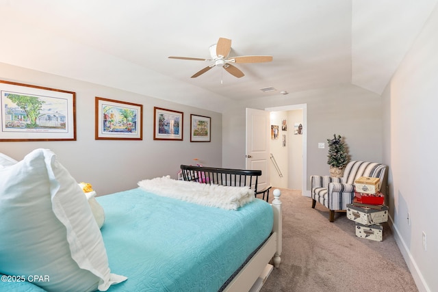 carpeted bedroom featuring visible vents, lofted ceiling, baseboards, and ceiling fan