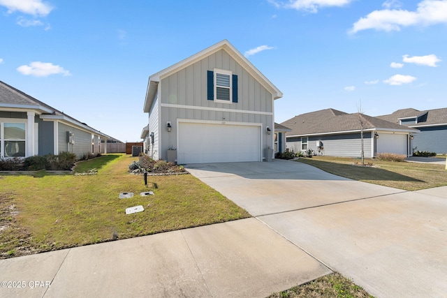 view of front of home featuring a front yard, an attached garage, board and batten siding, and driveway