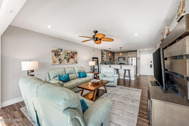 living room with recessed lighting, baseboards, dark wood finished floors, and ceiling fan