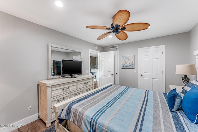 bedroom featuring a ceiling fan, baseboards, visible vents, dark wood finished floors, and recessed lighting