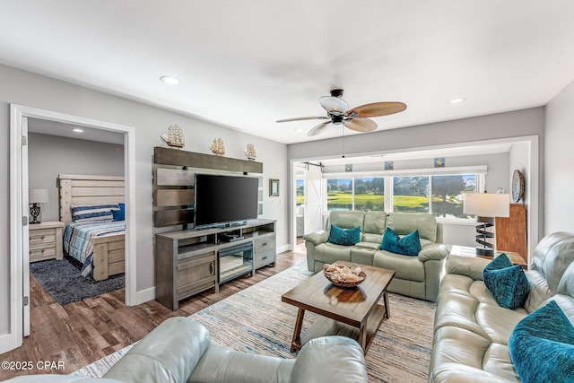 living area featuring recessed lighting, baseboards, a ceiling fan, and wood finished floors