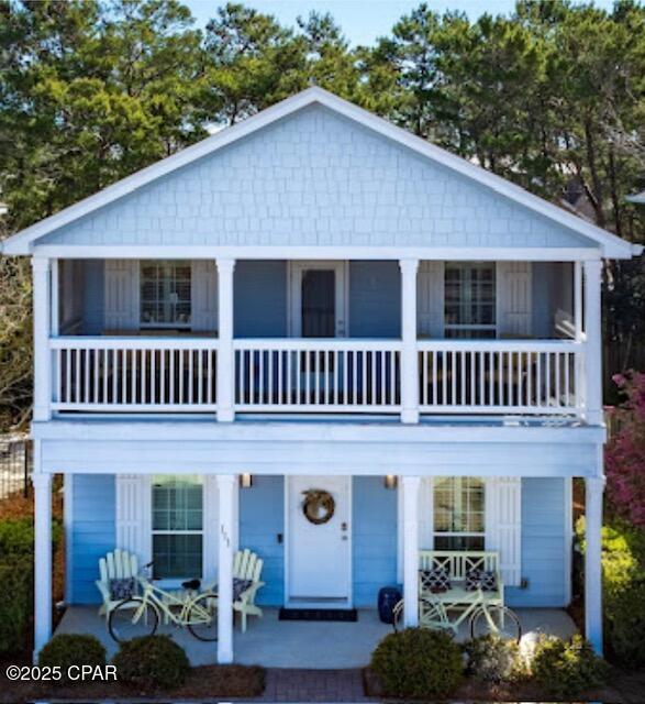 view of front facade with covered porch and a patio area