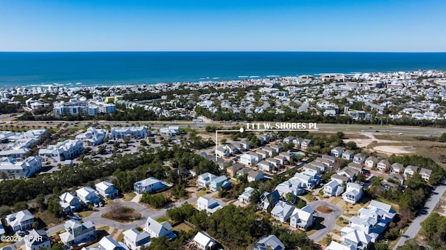 drone / aerial view featuring a residential view and a water view