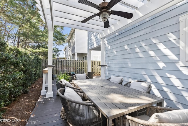 deck featuring outdoor dining area, fence, and ceiling fan