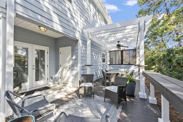 view of patio / terrace featuring outdoor dining space, french doors, a pergola, and a ceiling fan