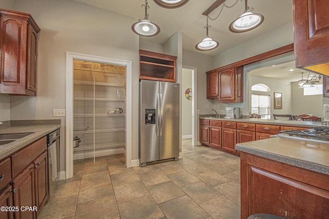 kitchen featuring a sink, open shelves, pendant lighting, and stainless steel appliances