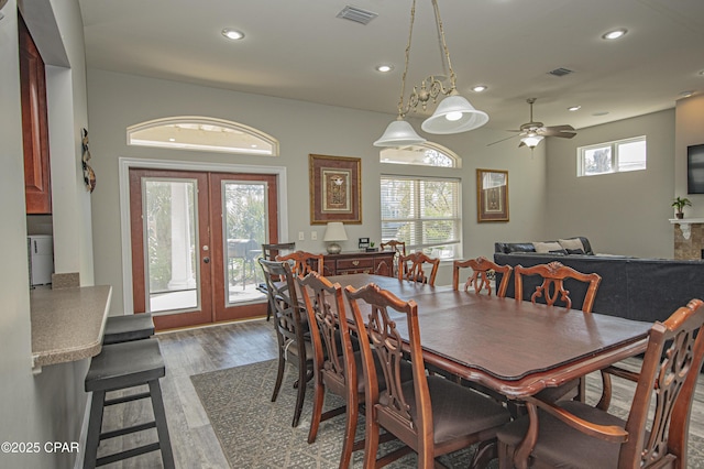 dining room featuring visible vents, recessed lighting, french doors, and wood finished floors