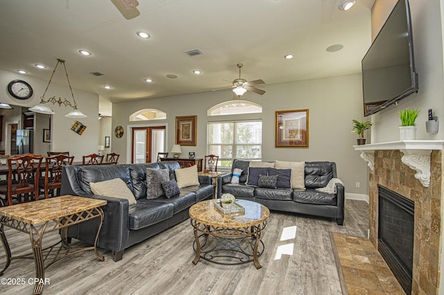 living room featuring visible vents, recessed lighting, a fireplace, and ceiling fan