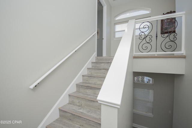 staircase with wood finished floors