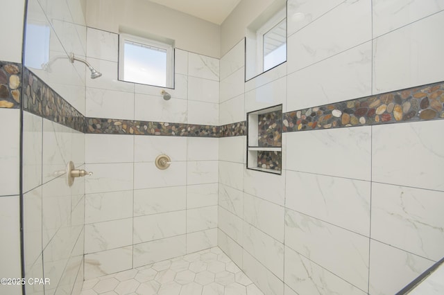 bathroom with tiled shower