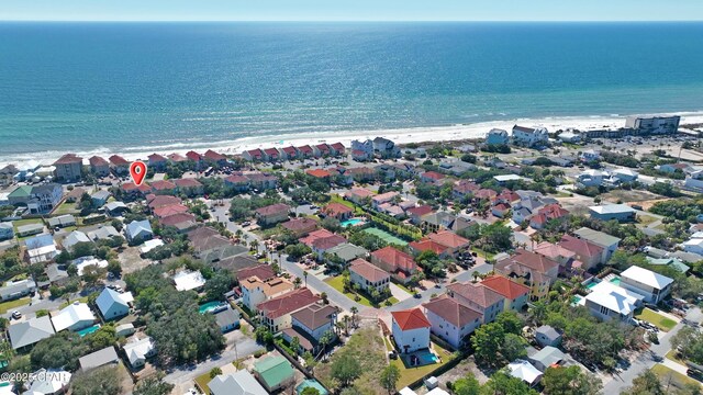 drone / aerial view with a residential view and a water view