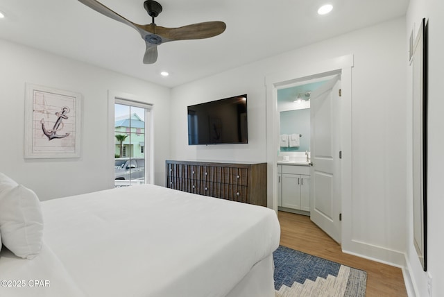 bedroom featuring recessed lighting, light wood-style flooring, ensuite bathroom, and ceiling fan