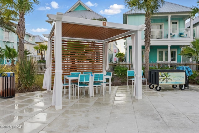 view of patio / terrace with outdoor dining area and fence