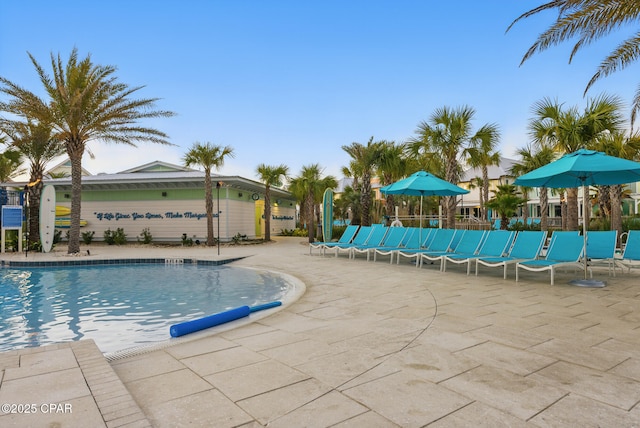 community pool featuring a patio area