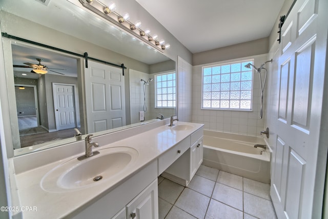 bathroom featuring tile patterned flooring, double vanity, shower / tub combination, and a sink