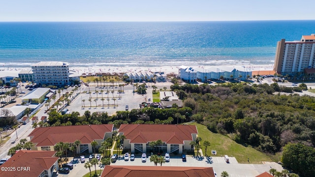 drone / aerial view with a beach view and a water view