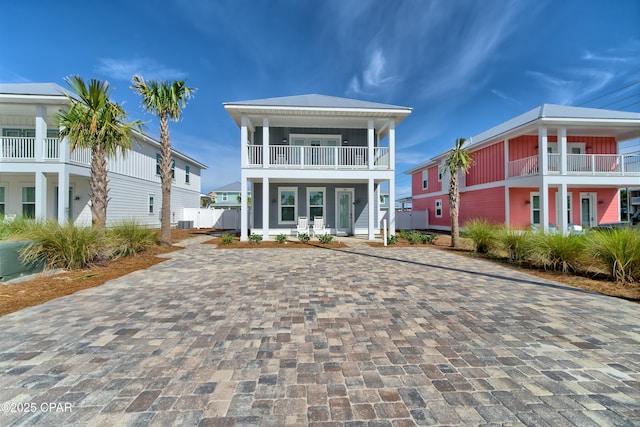 view of front of home featuring a balcony