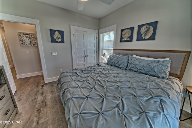 bedroom featuring a ceiling fan, baseboards, and wood finished floors