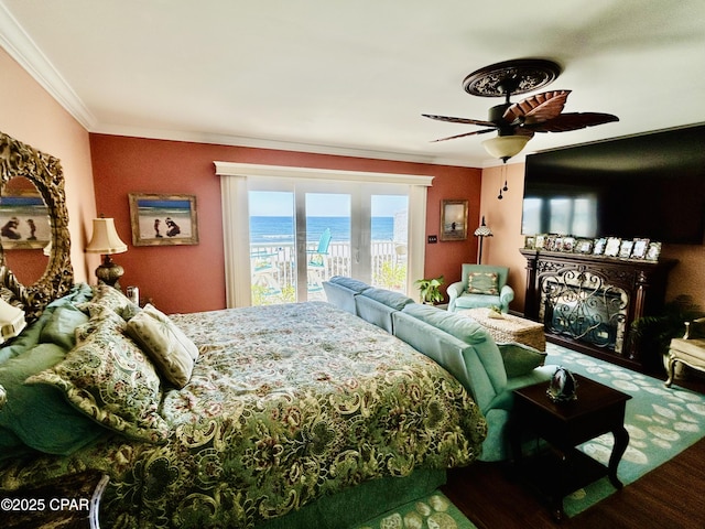 bedroom featuring a ceiling fan, access to exterior, wood finished floors, and ornamental molding