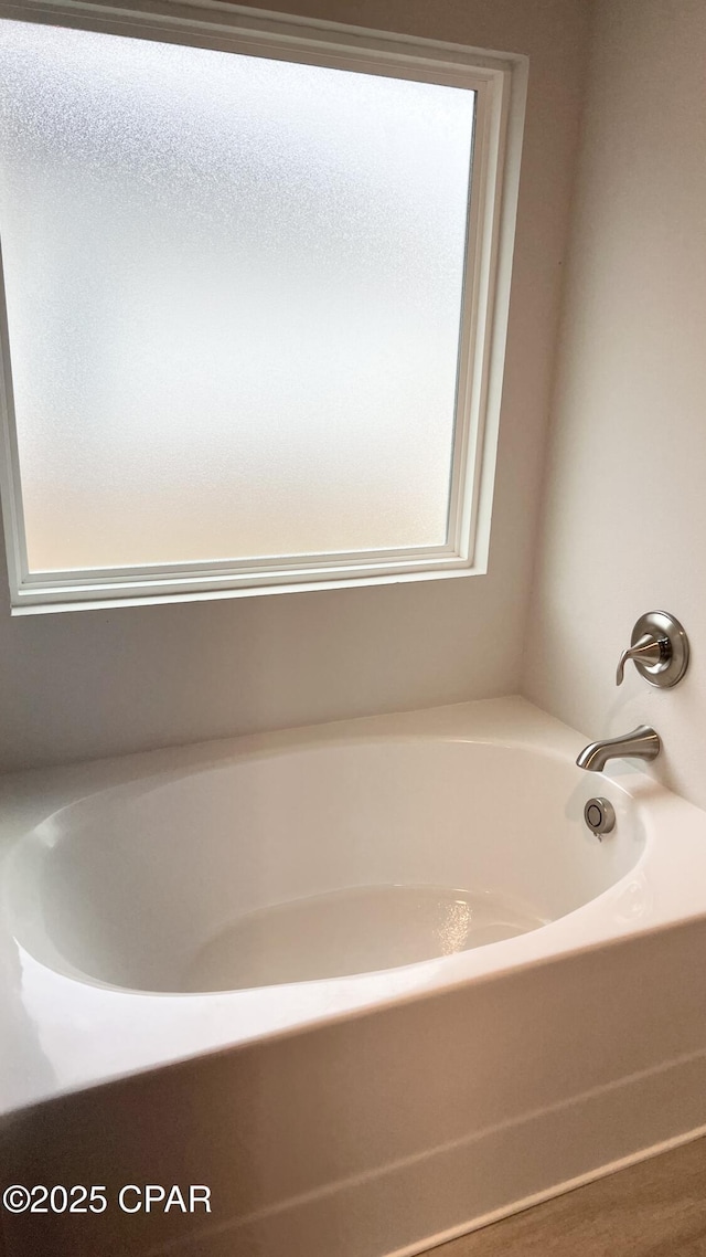 full bath with a tub to relax in