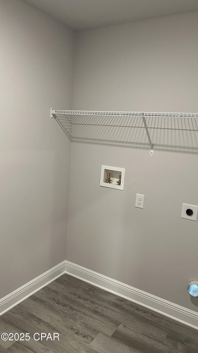 laundry area with baseboards, hookup for an electric dryer, dark wood finished floors, laundry area, and washer hookup