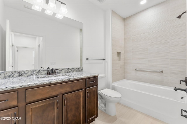 full bath with vanity, shower / bathing tub combination, and toilet