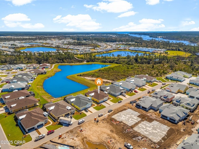 drone / aerial view featuring a water view and a residential view