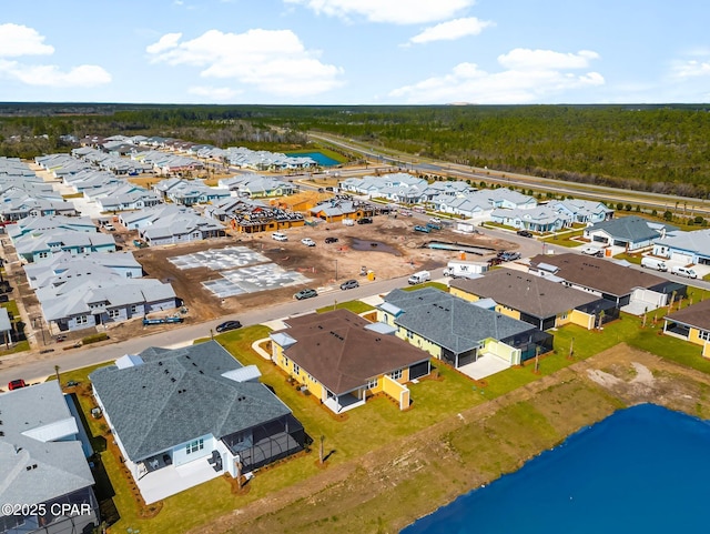 bird's eye view with a water view and a residential view