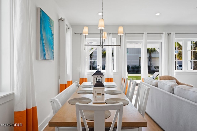 dining space featuring recessed lighting and wood finished floors