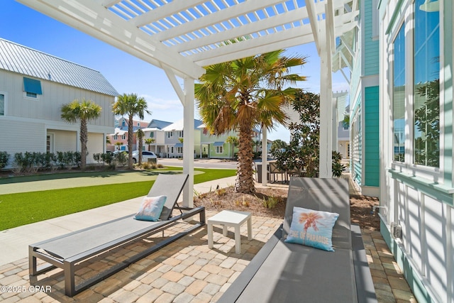 view of patio / terrace with a residential view and a pergola