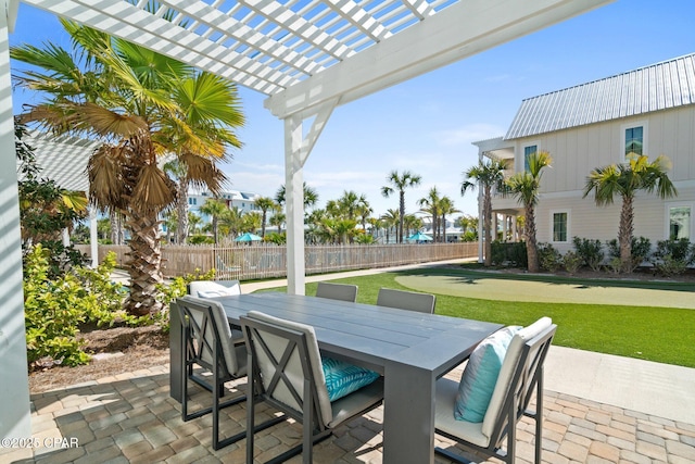 view of patio / terrace featuring outdoor dining space, fence private yard, and a pergola