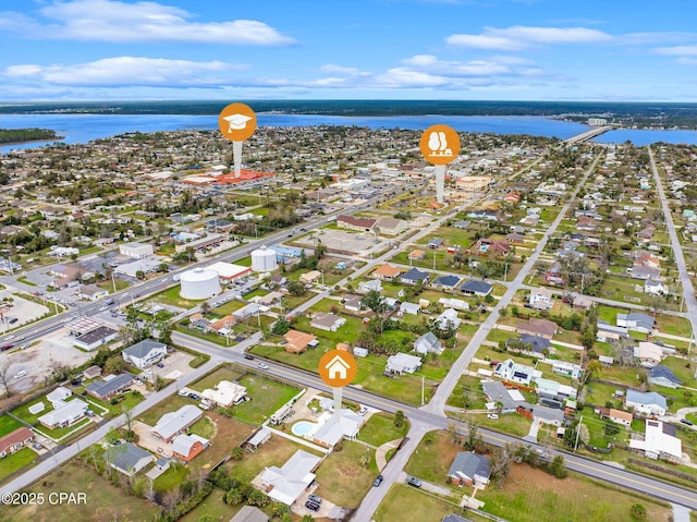 drone / aerial view with a residential view and a water view