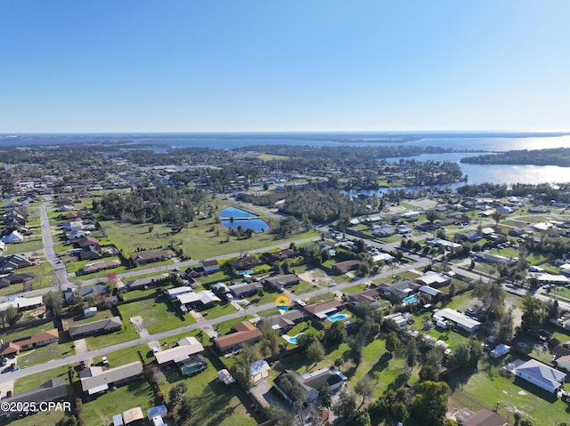 bird's eye view featuring a residential view and a water view