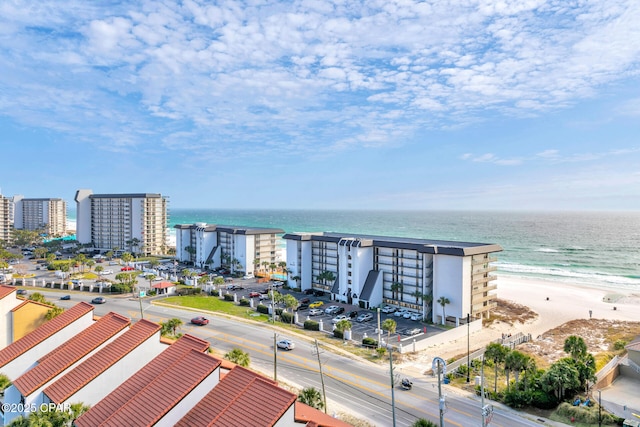 birds eye view of property with a view of the beach and a water view