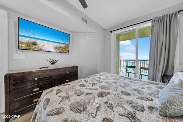 bedroom featuring access to exterior, visible vents, a ceiling fan, and wood finished floors