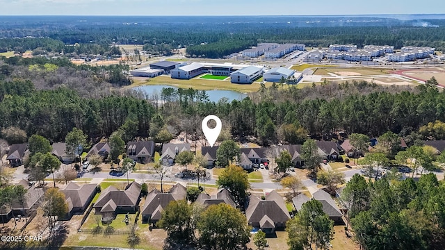 drone / aerial view featuring a residential view and a water view