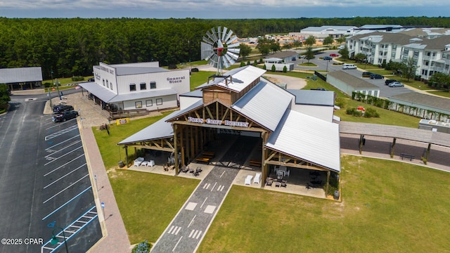 birds eye view of property with a forest view