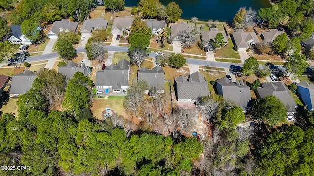 bird's eye view featuring a residential view and a water view