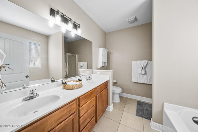 full bathroom featuring visible vents, double vanity, a sink, a shower stall, and tile patterned floors