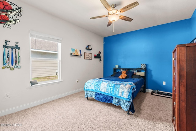 bedroom featuring ceiling fan, baseboards, and carpet floors