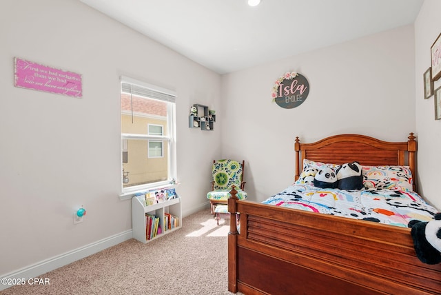 carpeted bedroom with baseboards