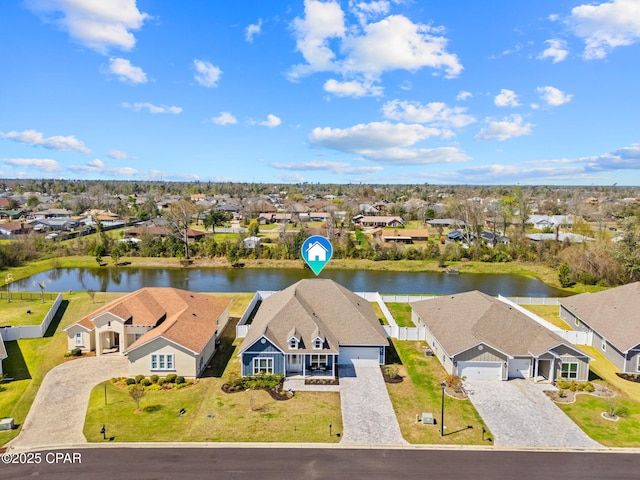 aerial view featuring a residential view and a water view