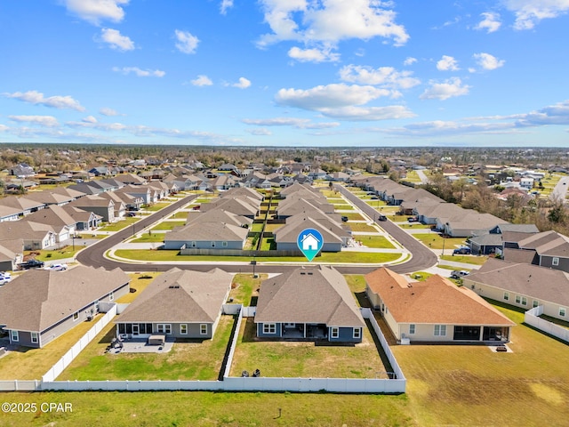 birds eye view of property with a residential view