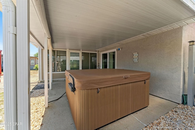 view of patio / terrace with a hot tub