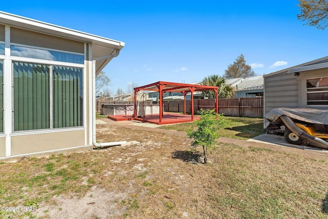 view of yard featuring a deck and a fenced backyard