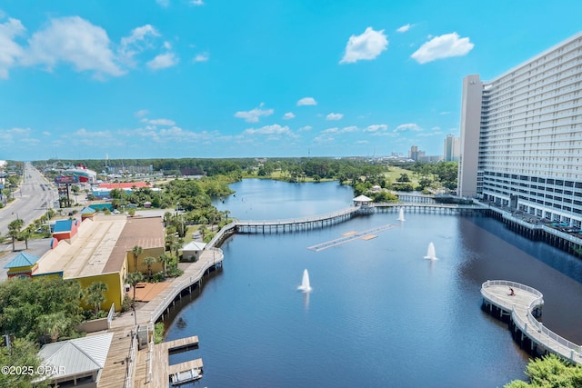 exterior space with a water view and a city view