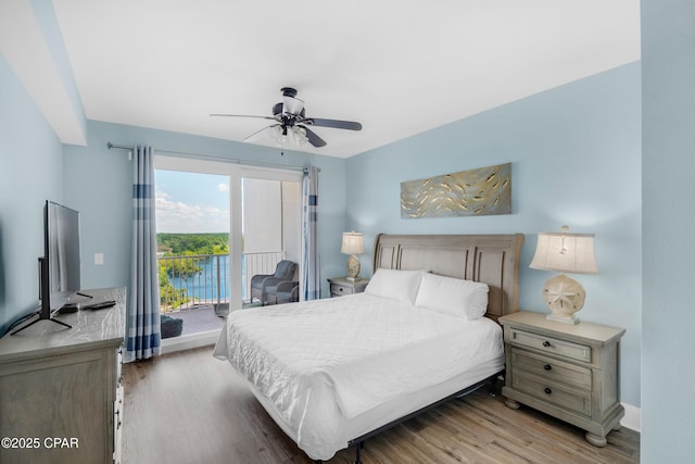 bedroom with access to outside, wood finished floors, baseboards, and ceiling fan